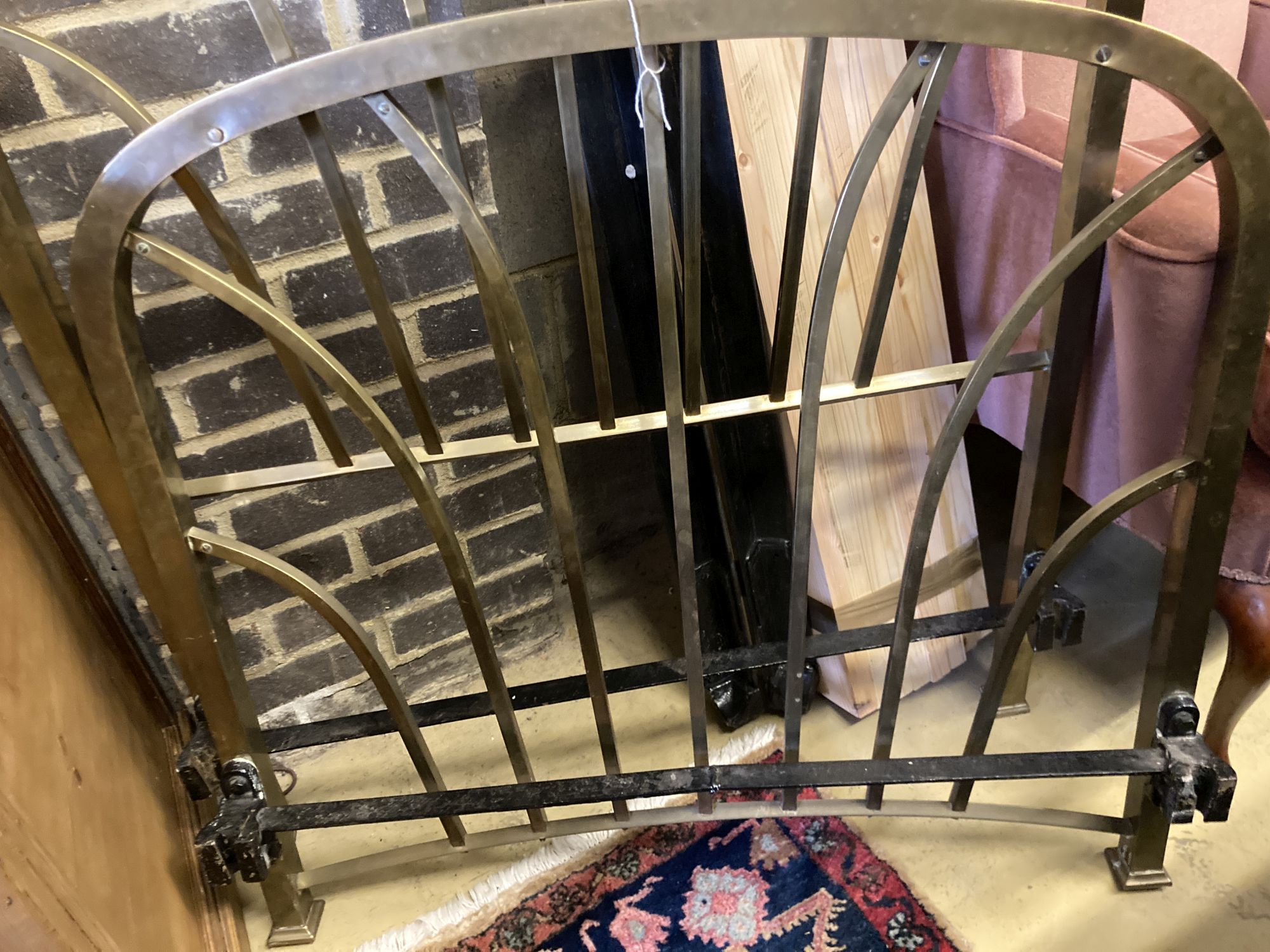 An Edwardian brass 3ft. single bed frame with slats and side irons